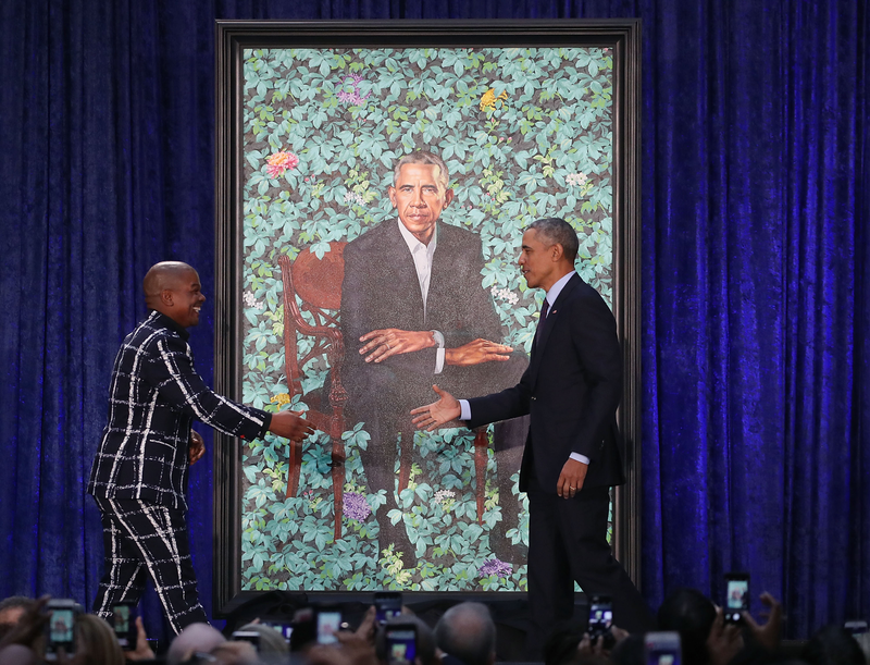 Former U.S. President Barack Obama stands artist Kehinde Wiley next to his newly unveiled portrait during a ceremony at the Smithsonian’s National Portrait Gallery, on February 12, 2018 in Washington, DC. The portraits were commissioned by the Gallery, for Kehinde Wiley to create President Obama’s portrait, and Amy Sherald that of Michelle Obama. (Mark Wilson/Getty Images)
